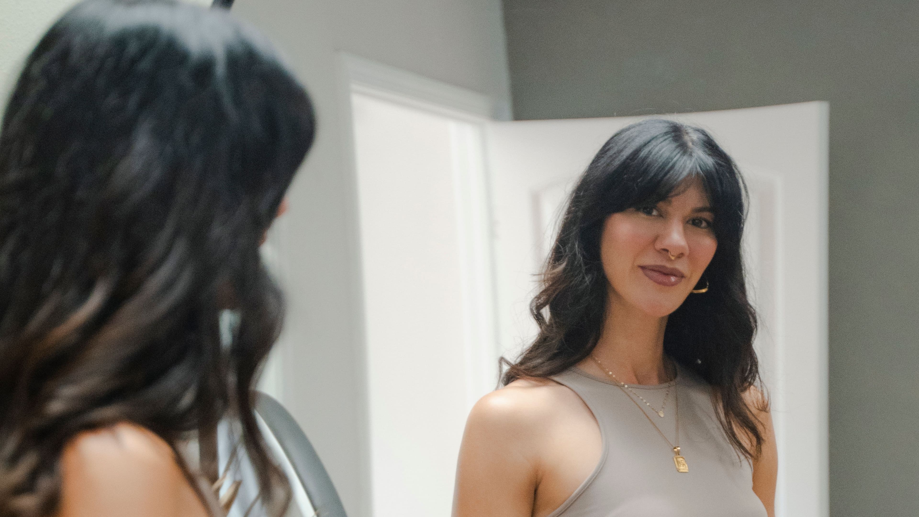 maggie cadavero looking in mirror